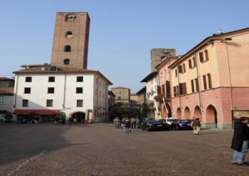 piazza in Alba with medieval towers in its picturesque historic centre